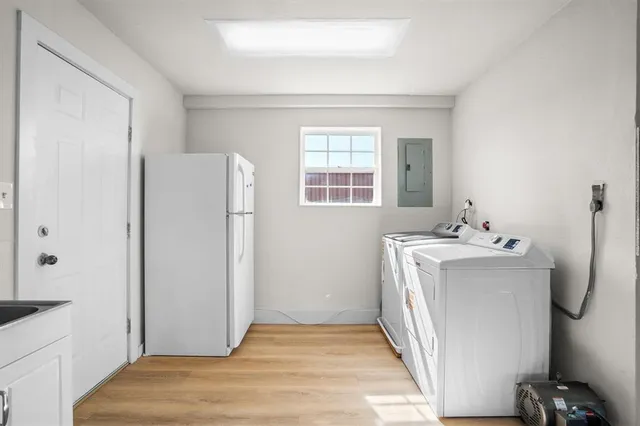 a utility room with closet dryer and washer