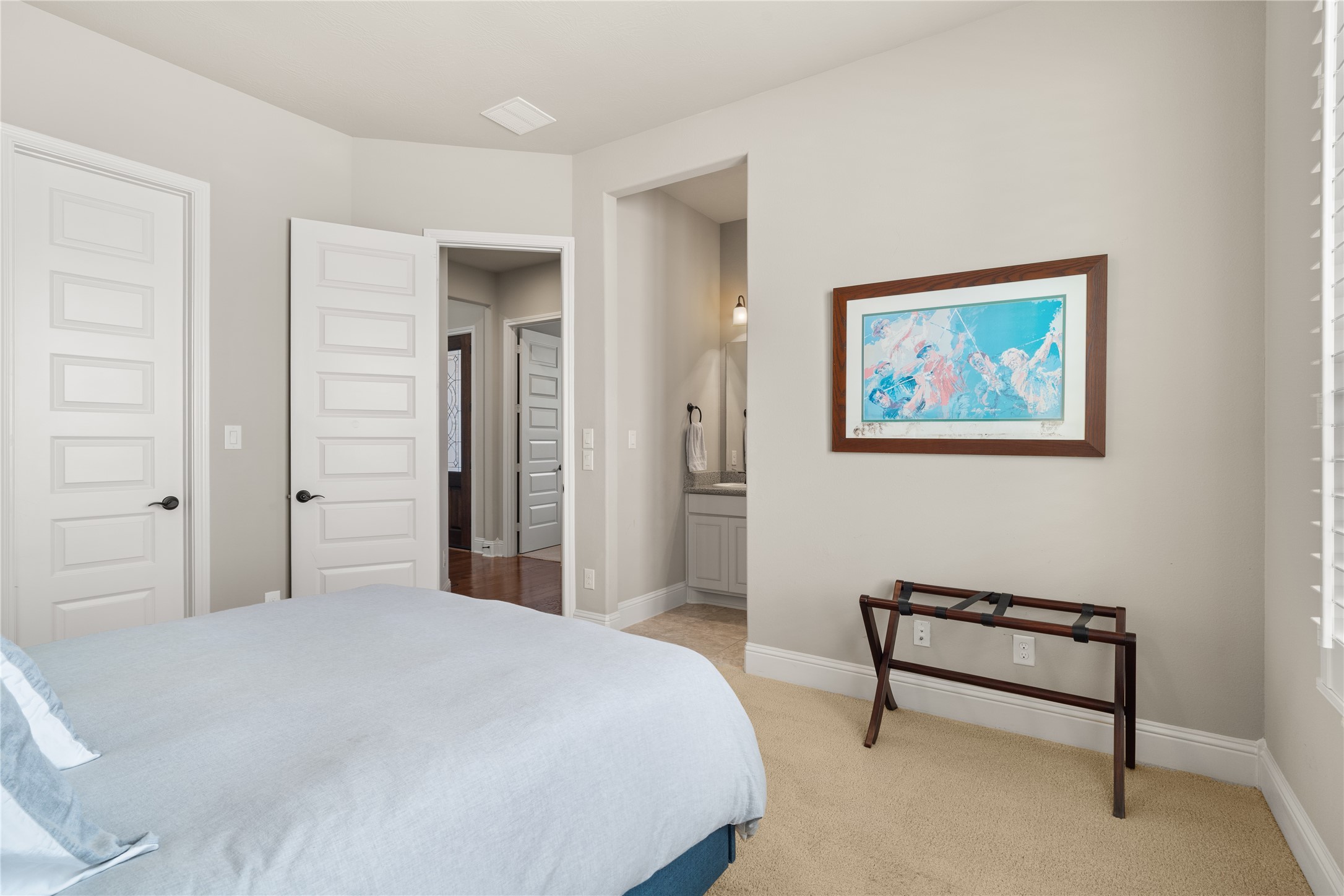 19813 Cullen Ridge Drive Porter, TX 77365 - Photo 34 of 44 Discover Bedroom 2's seamless design, featuring easy access to the hall and a convenient Jack and Jill bathroom, perfect for modern living.