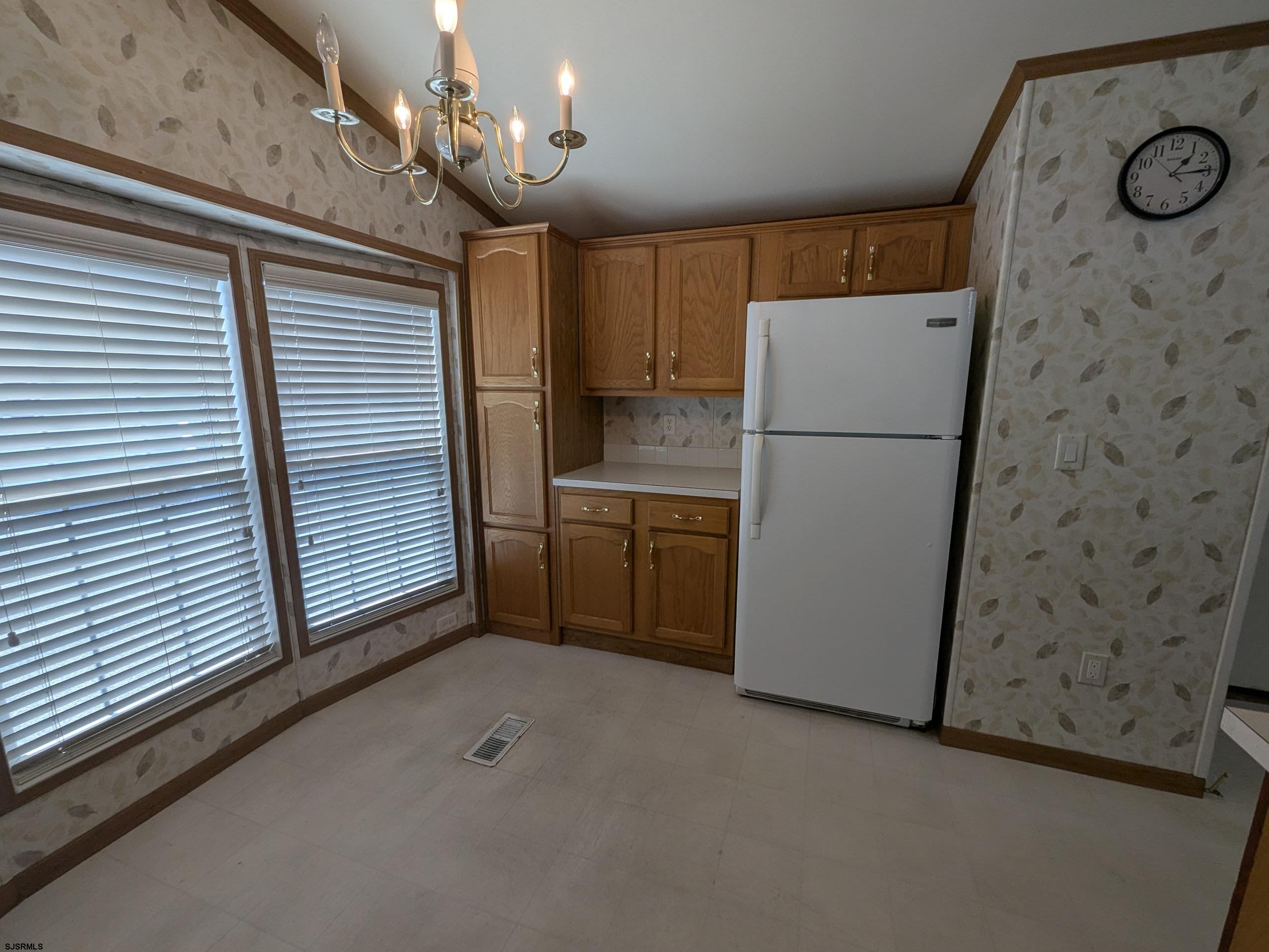 430 South Shore Road, Unit 21 Marmora, NJ 08223 - Photo 4 of 14 a view of a kitchen with a sink and refrigerator