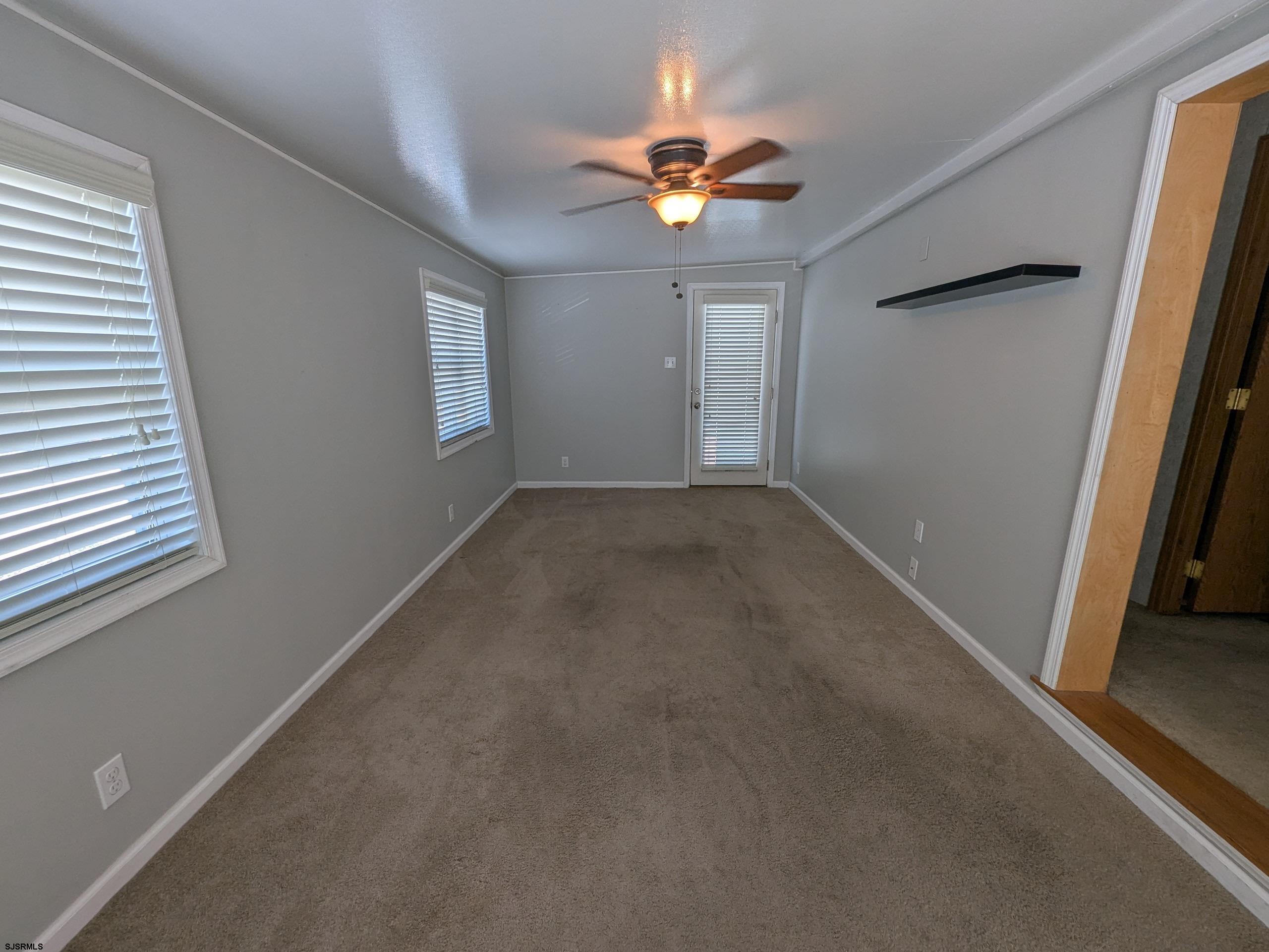 430 South Shore Road, Unit 21 Marmora, NJ 08223 - Photo 7 of 14 wooden floor in an empty room with a window