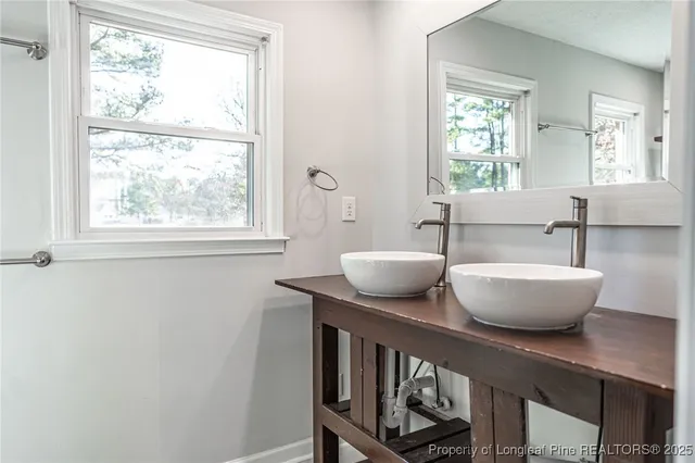 a view of a room with windows and wooden floor