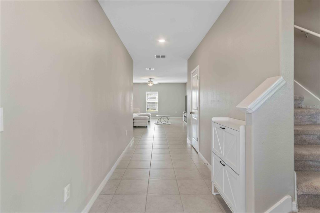 9440 Lemon Drop Loop Sun City Center, FL 33573 - Photo 7 of 55 a view of a hallway with a bathroom