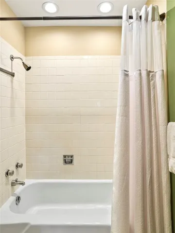 a bathroom with a shower curtain