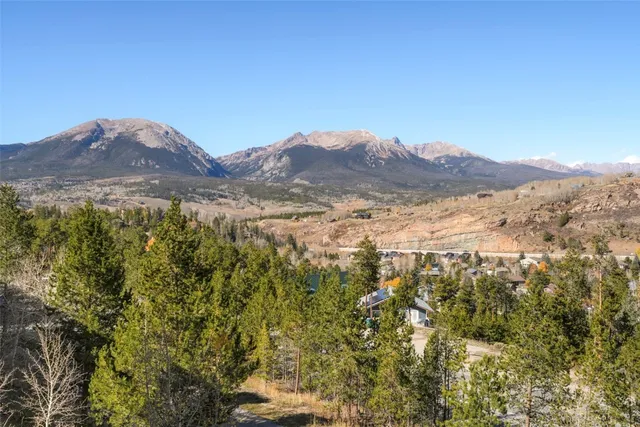 a view of a mountain range in a cloudy sky
