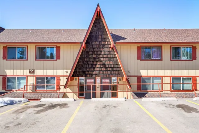 a view of front of house with large windows