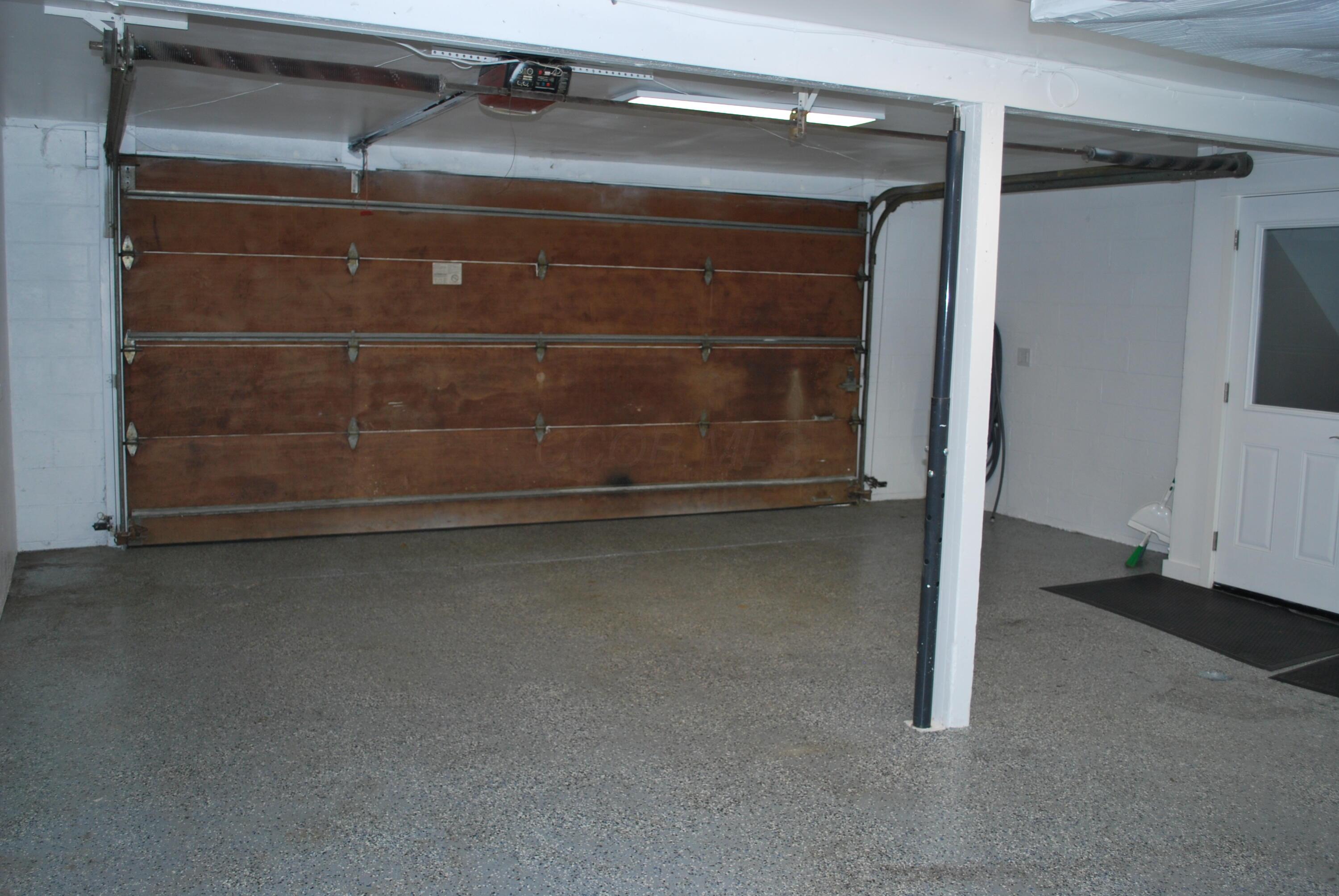 7404 Worthington Road Westerville, OH 43082 - Photo 32 of 32 Heated garage with wooden door