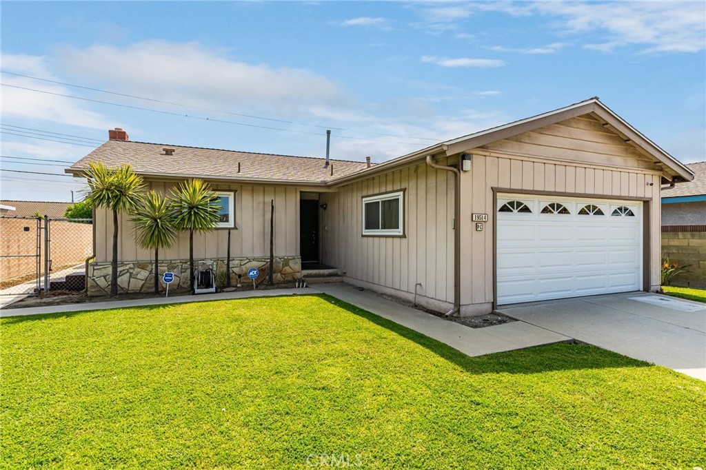 19514 Enslow Drive Carson, CA 90746 - Photo 1 of 51 a front view of house with yard and garage