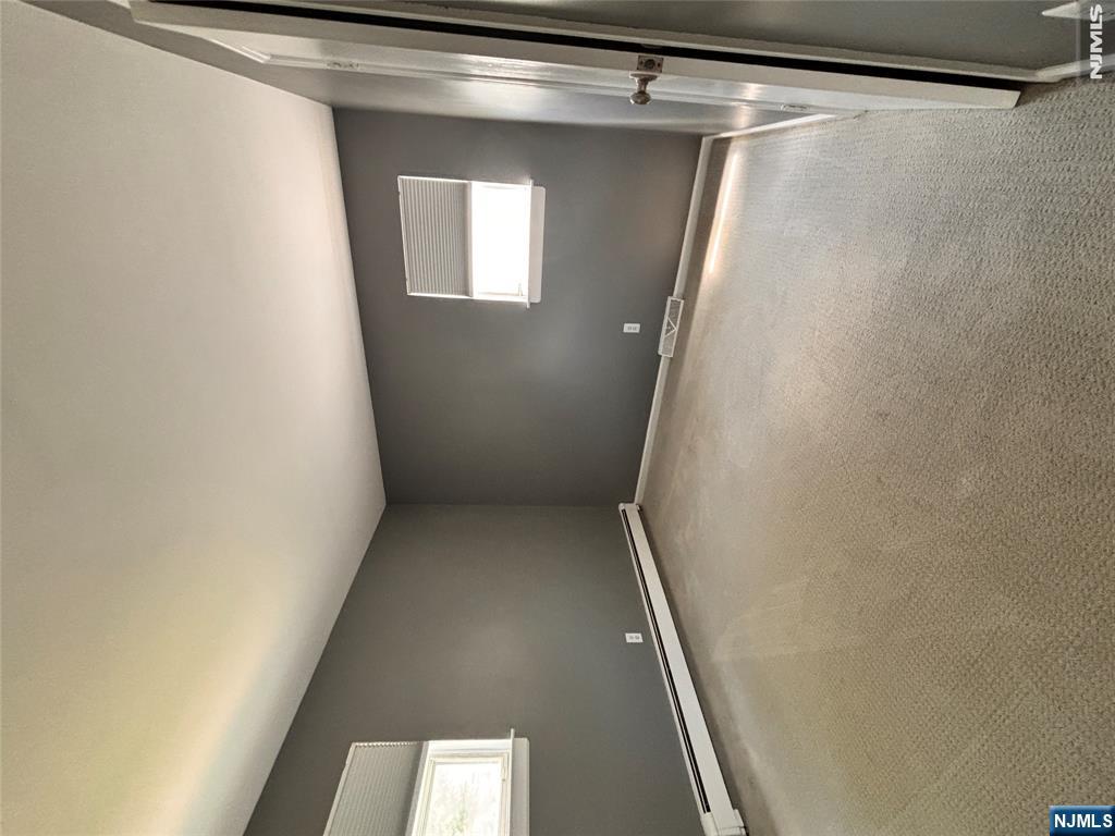 21 Wanamaker Avenue, Unit 1 Waldwick, NJ 07463 - Photo 9 of 13 an empty room with a empty space and window