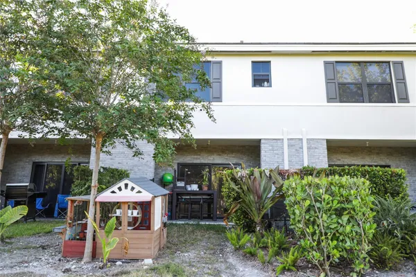 a view of house with outdoor seating