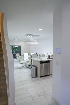 a view of living room and kitchen with furniture