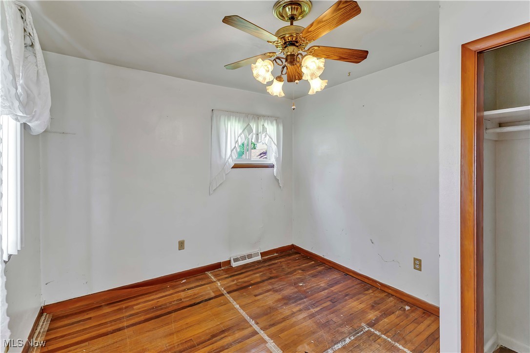 321 Overlook Road Vermilion, OH 44089 - Photo 17 of 27 Unfurnished bedroom featuring hardwood flooring and a ceiling fan