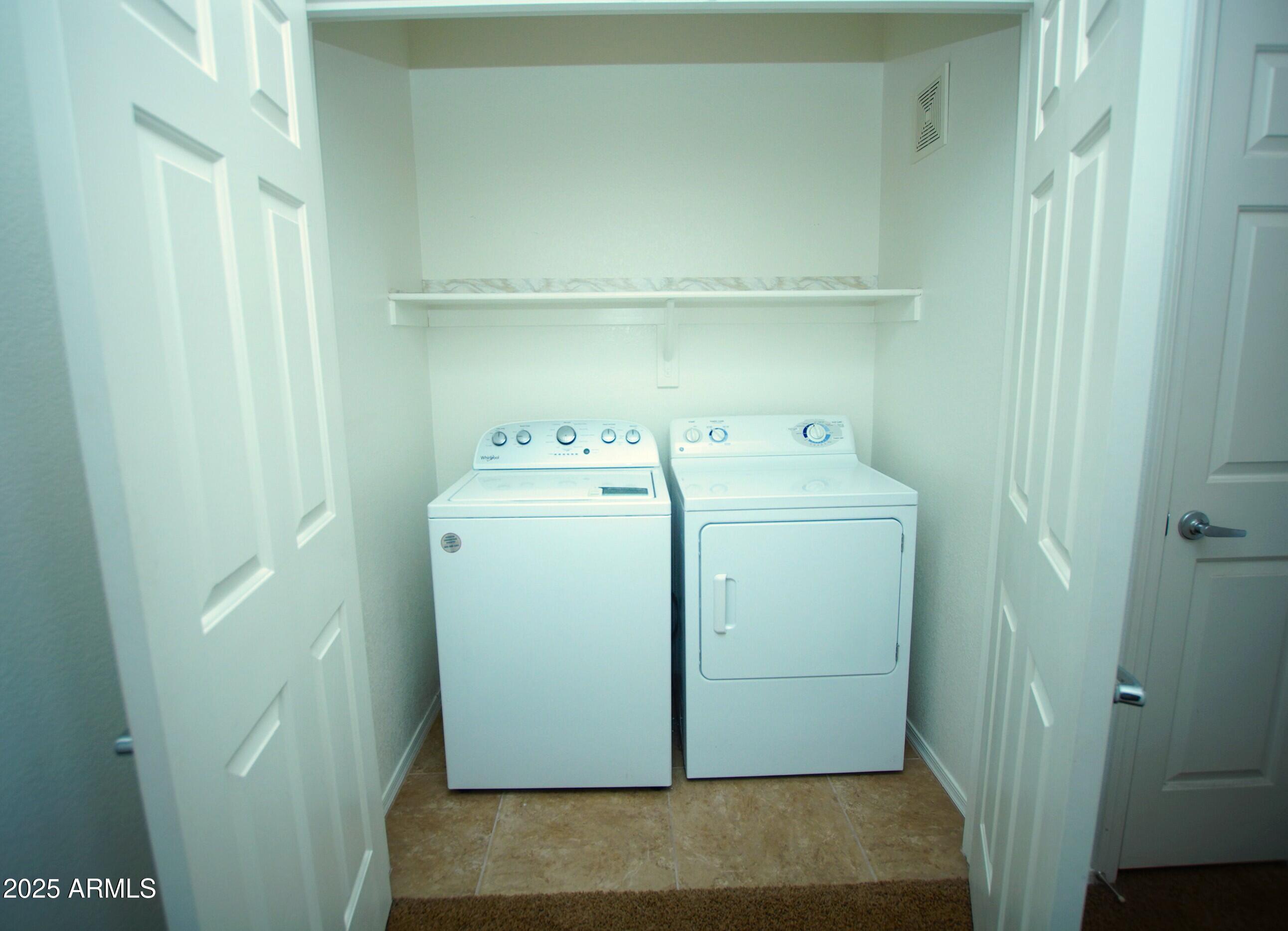 2150 West Alameda Road, Unit 1398 Phoenix, AZ 85085 - Photo 19 of 29 a utility room with dryer and washer