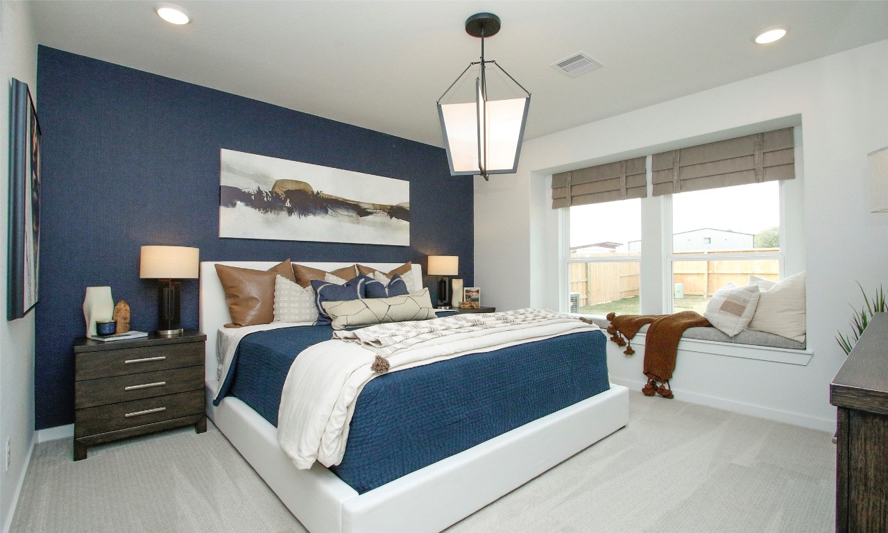 4028 Colony Riv Rock Boulevard Pinehurst, TX 77362 - Photo 14 of 21 a bedroom with bed and window