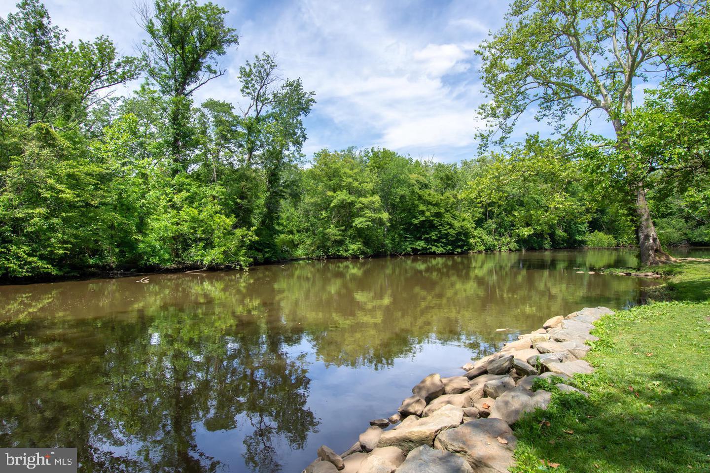 2 North Main Street Greensboro, MD 21639 - Photo 16 of 19 a view of a lake with houses in the back