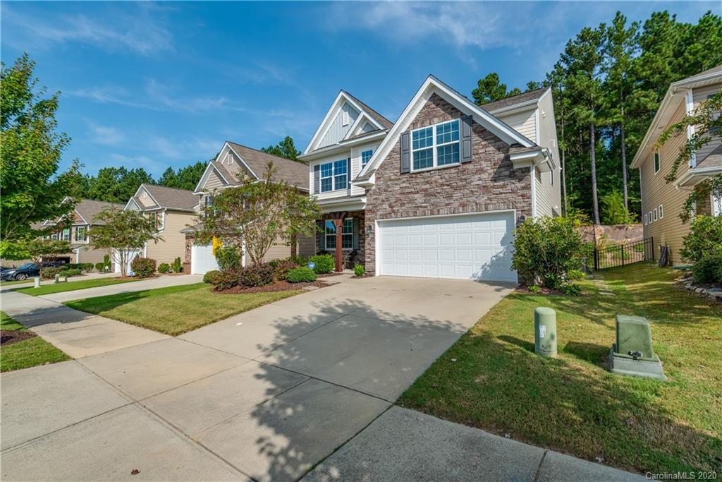 78094 Rillstone Drive Lancaster, SC 29720 - Photo 2 of 26 a front view of a house with a yard and garage