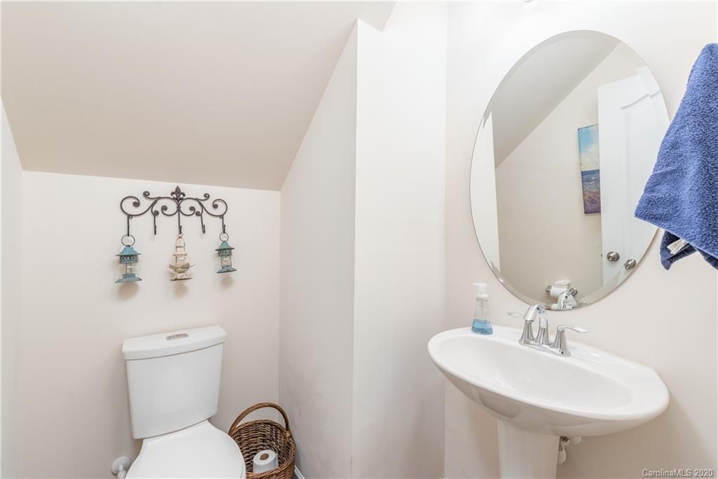 78094 Rillstone Drive Lancaster, SC 29720 - Photo 12 of 26 a bathroom with a sink mirror and toilet