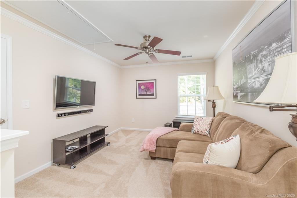 78094 Rillstone Drive Lancaster, SC 29720 - Photo 14 of 26 a bedroom with furniture and a flat screen tv