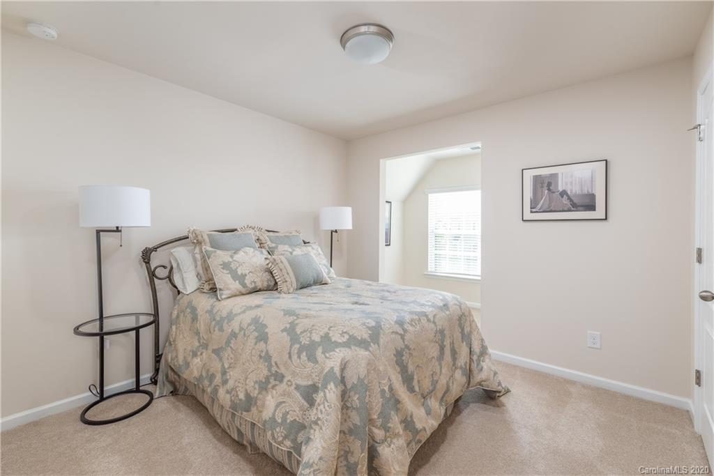 78094 Rillstone Drive Lancaster, SC 29720 - Photo 16 of 26 a large bed sitting in a bedroom next to a window