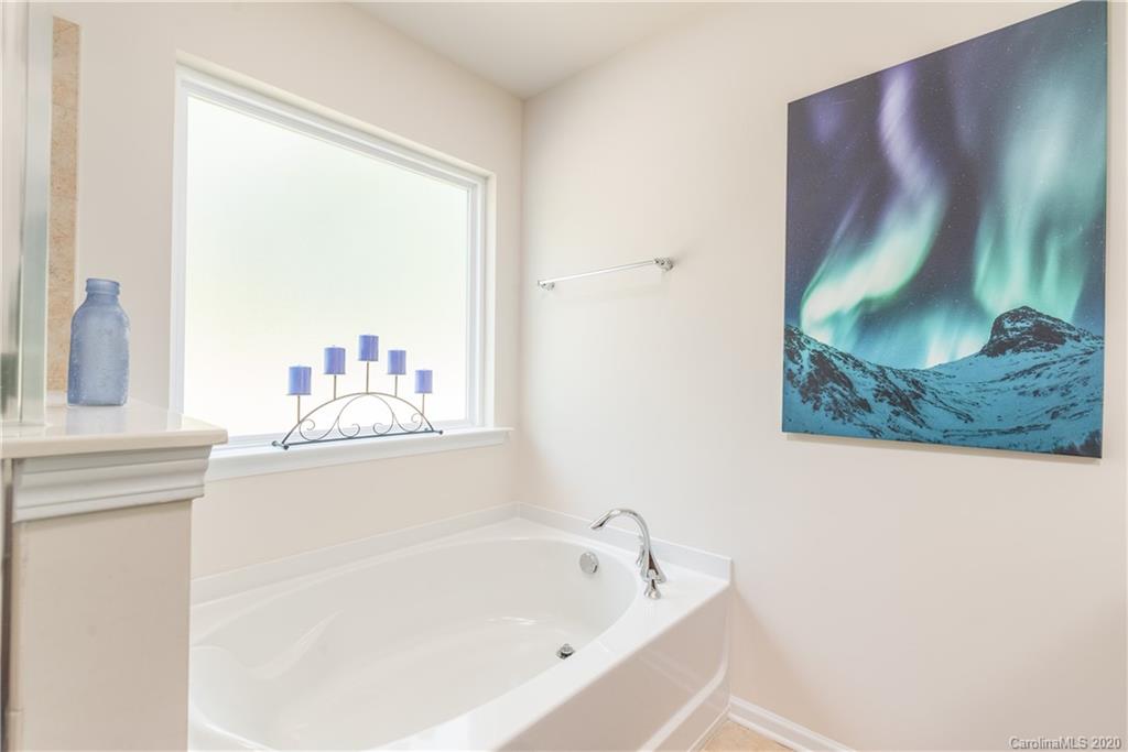 78094 Rillstone Drive Lancaster, SC 29720 - Photo 20 of 26 a bathroom with a bathtub and a window