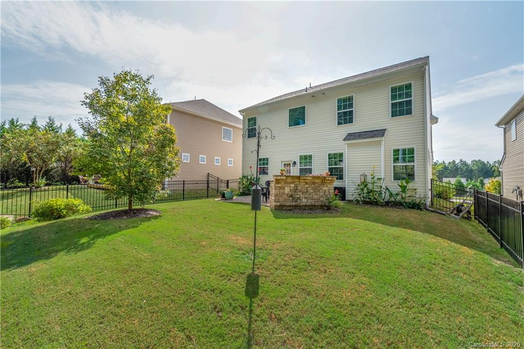 78094 Rillstone Drive Lancaster, SC 29720 - Photo 25 of 26 a view of a house with backyard and a tree