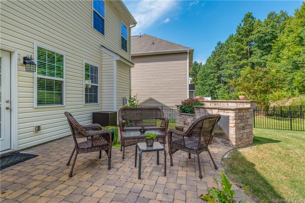 78094 Rillstone Drive Lancaster, SC 29720 - Photo 26 of 26 a view of a house with a backyard and a sitting area
