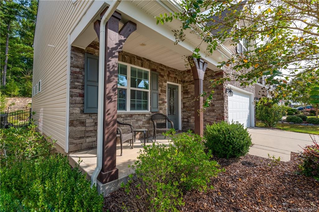 78094 Rillstone Drive Lancaster, SC 29720 - Photo 4 of 26 a view of patio with table and chairs and potted plants