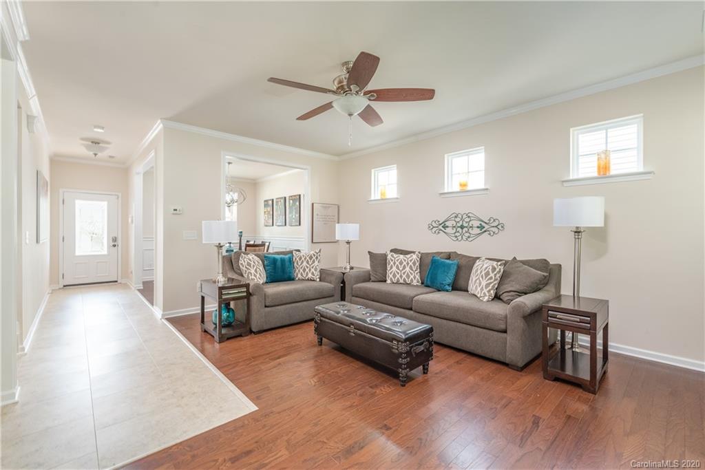 78094 Rillstone Drive Lancaster, SC 29720 - Photo 8 of 26 a living room with furniture and a chandelier