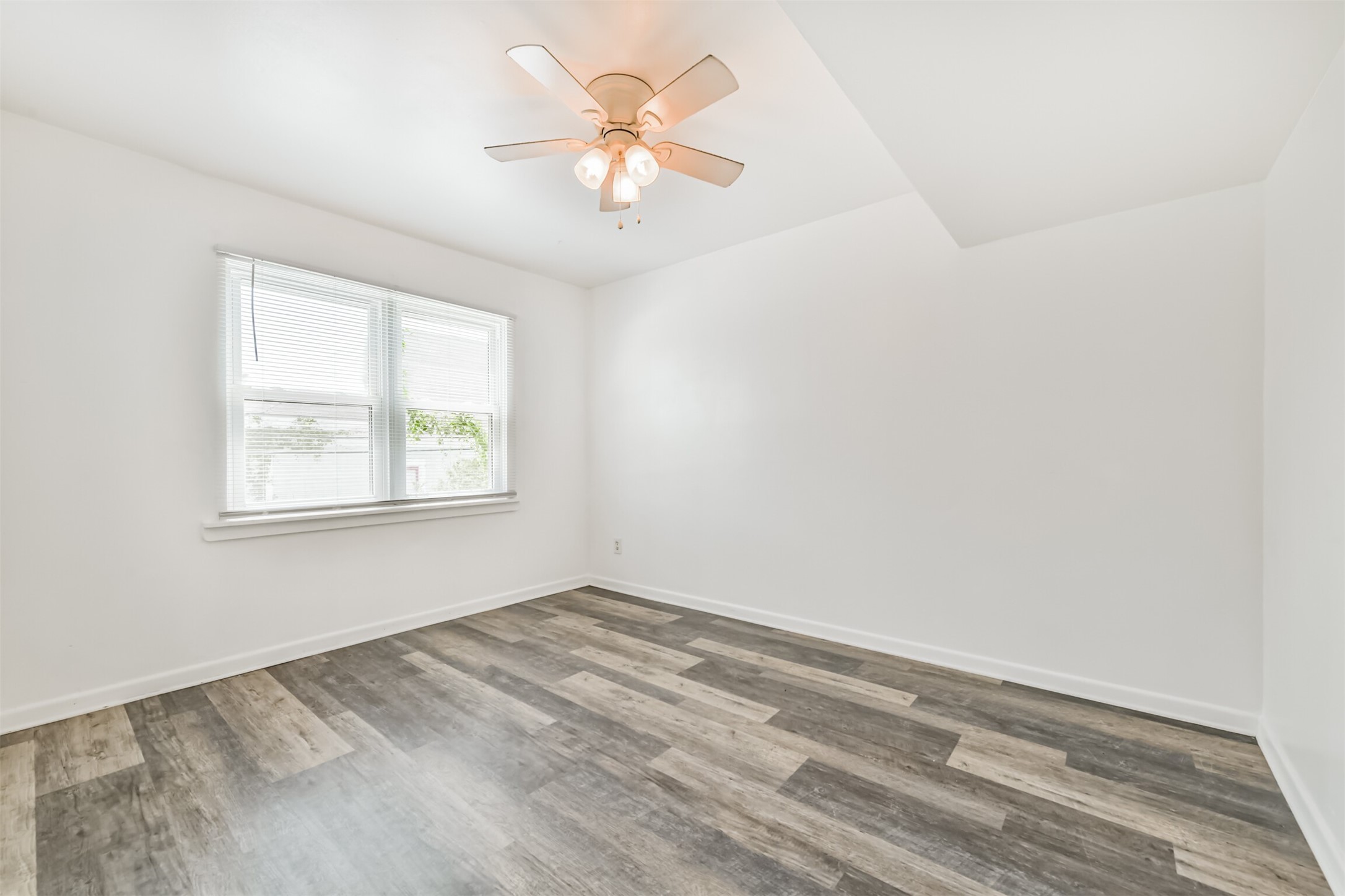 123 Strand Street, Unit REAR Galveston, TX 77550 - Photo 14 of 24 an empty room with a window