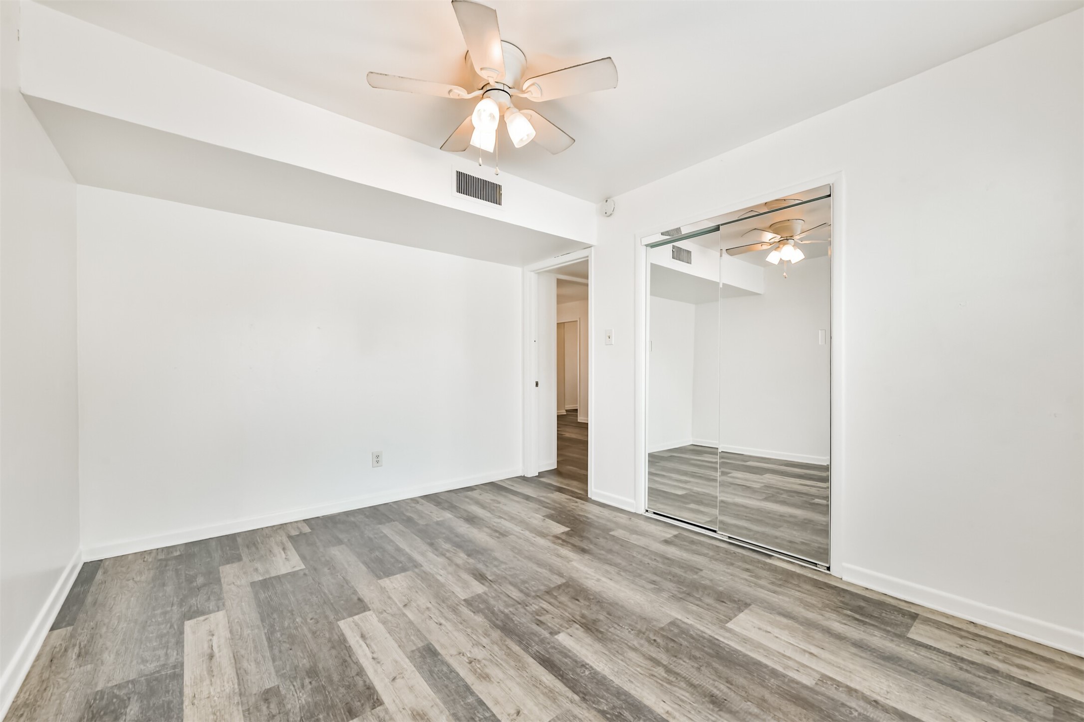 123 Strand Street, Unit REAR Galveston, TX 77550 - Photo 15 of 24 wooden floor in an empty room