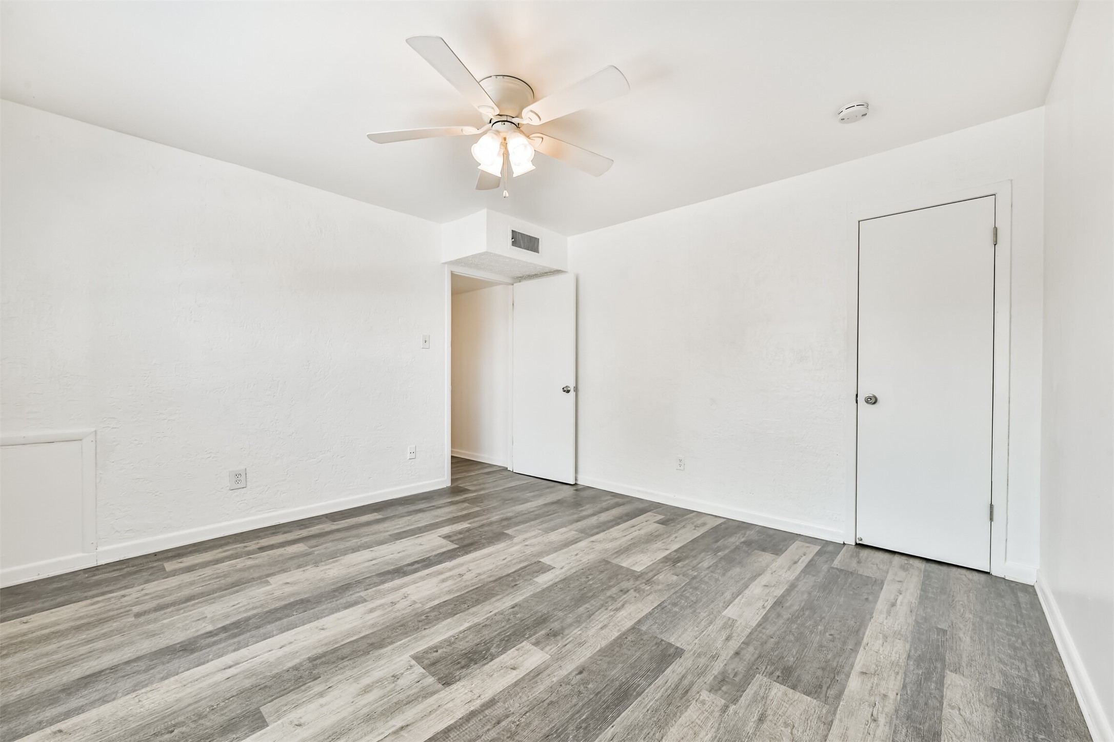 123 Strand Street, Unit REAR Galveston, TX 77550 - Photo 17 of 24 wooden floor in an empty room