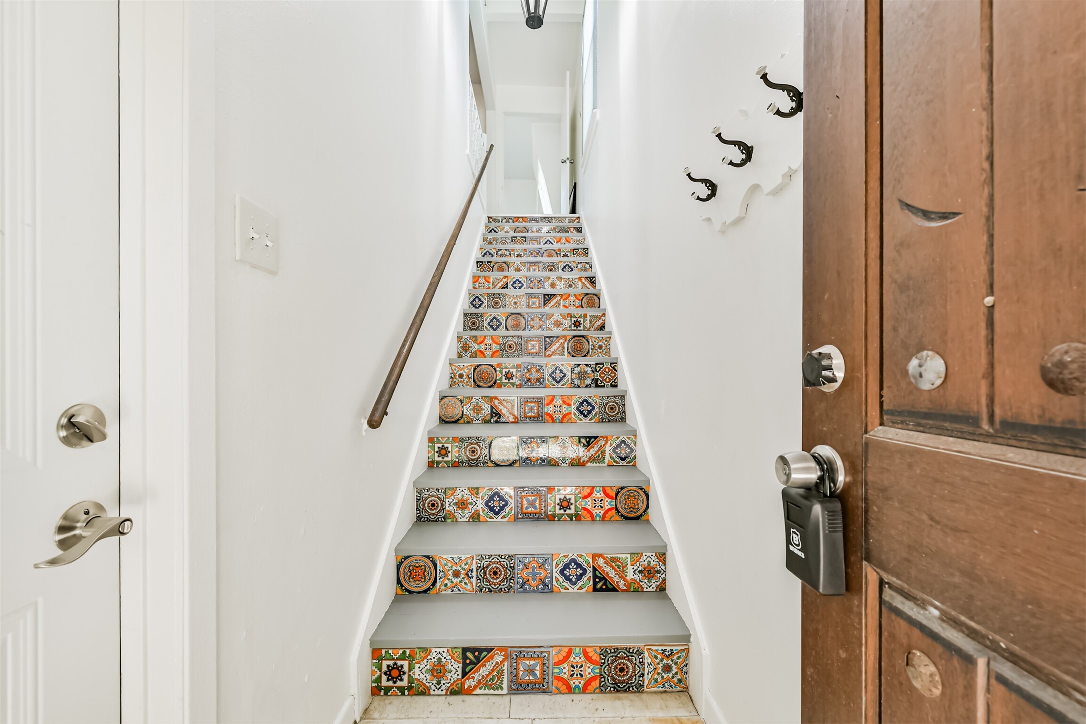 123 Strand Street, Unit REAR Galveston, TX 77550 - Photo 3 of 24 a view of a hallway with wooden floor and staircase
