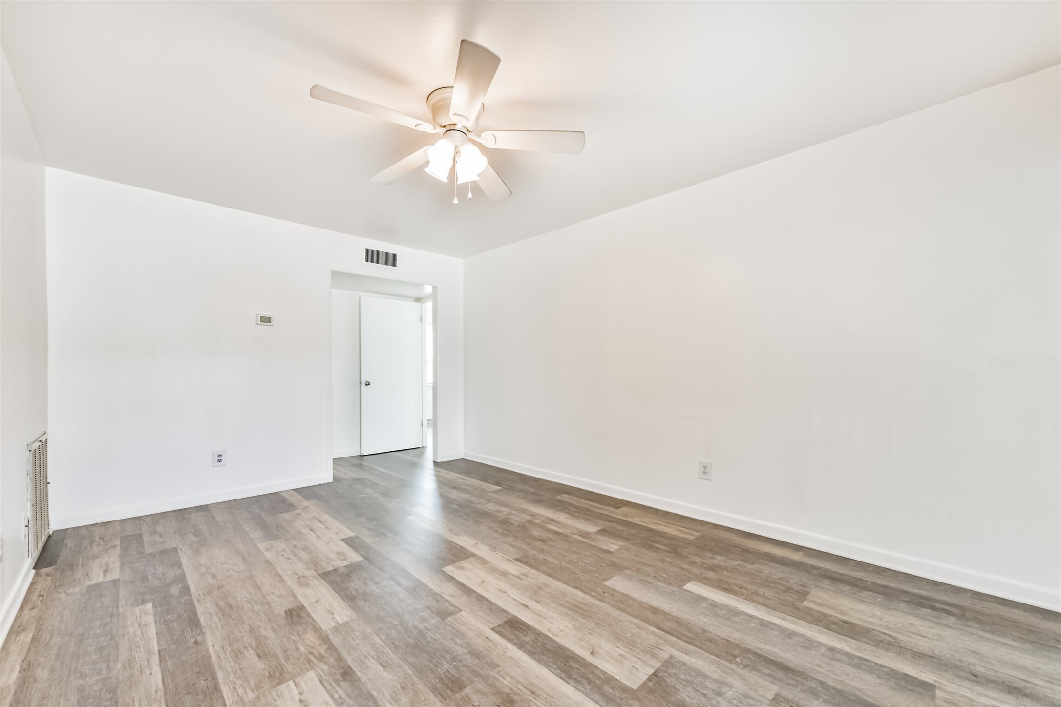 123 Strand Street, Unit REAR Galveston, TX 77550 - Photo 6 of 24 wooden floor in an empty room