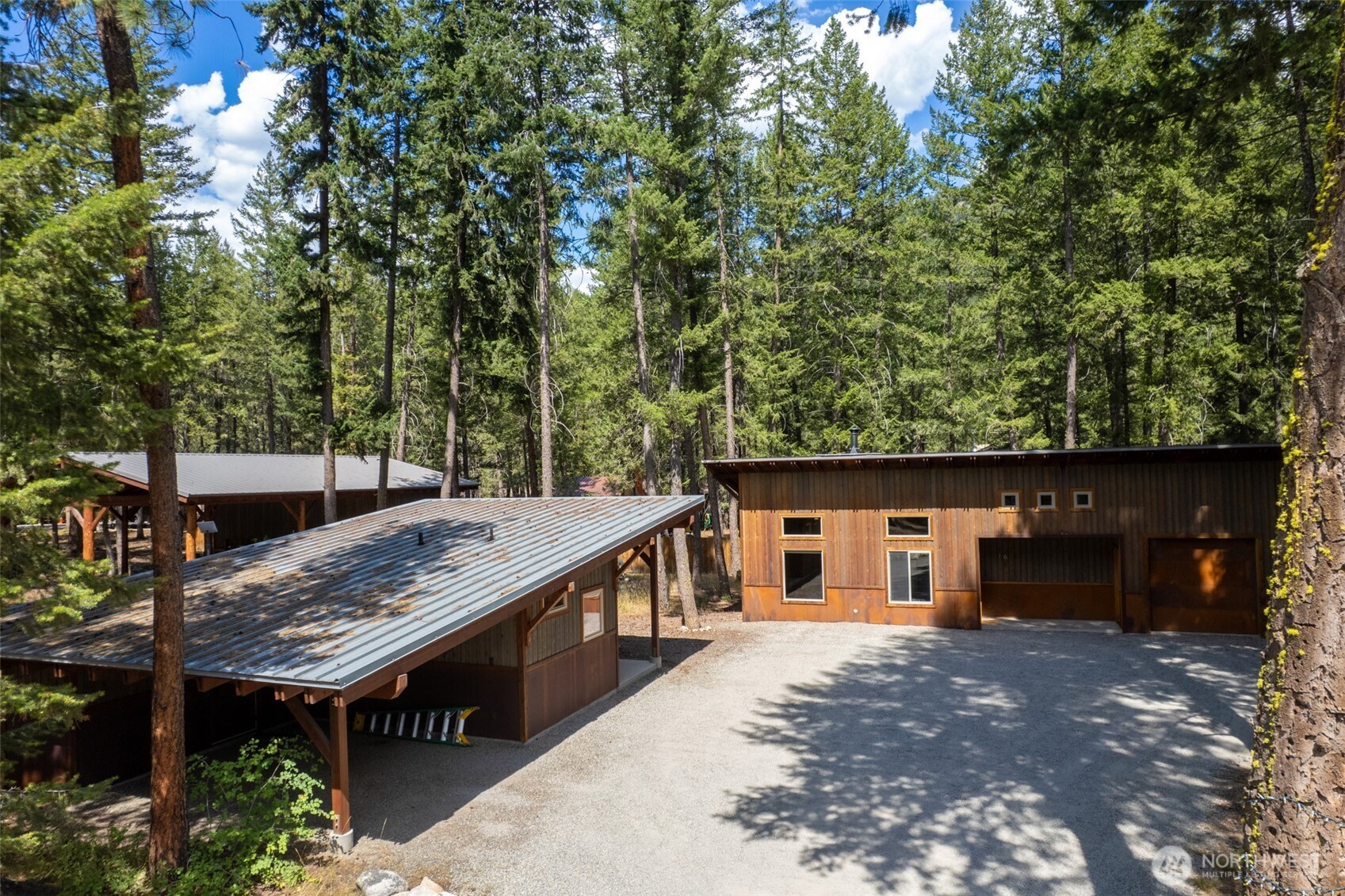 16 Littell Road Mazama, WA 98833 - Photo 40 of 40 a view of a house with backyard and sitting area