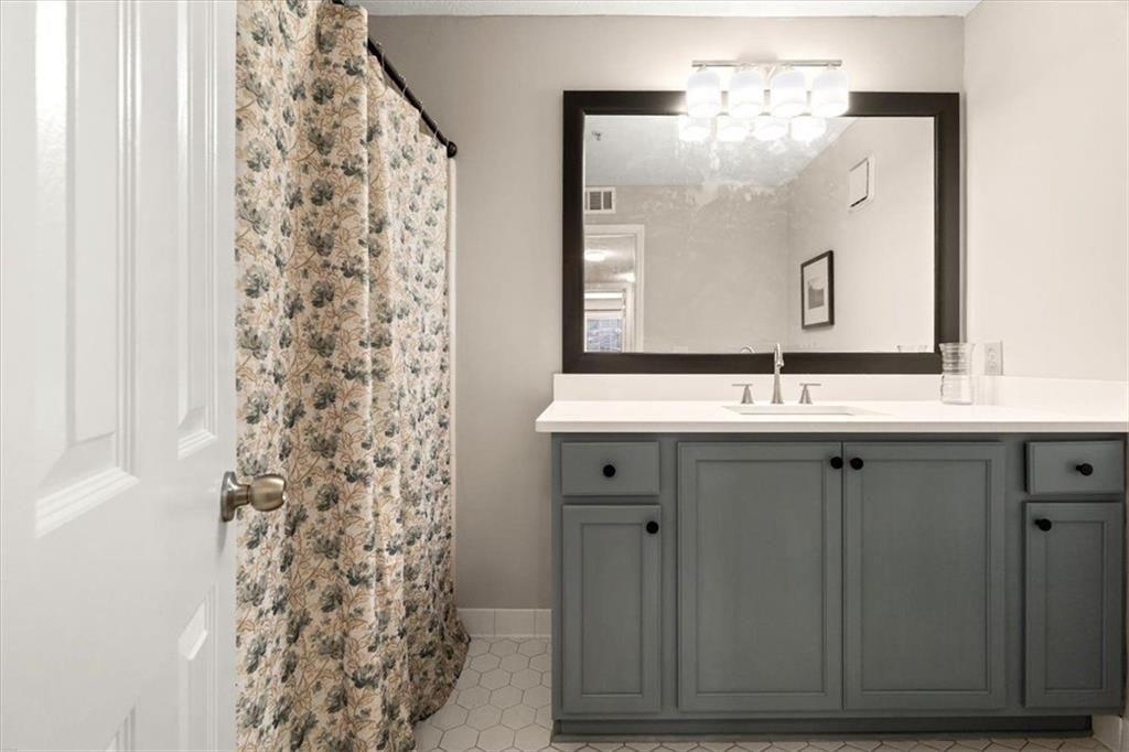 1411 Oakridge Circle Decatur, GA 30033 - Photo 15 of 26 a bathroom with a sink and a mirror