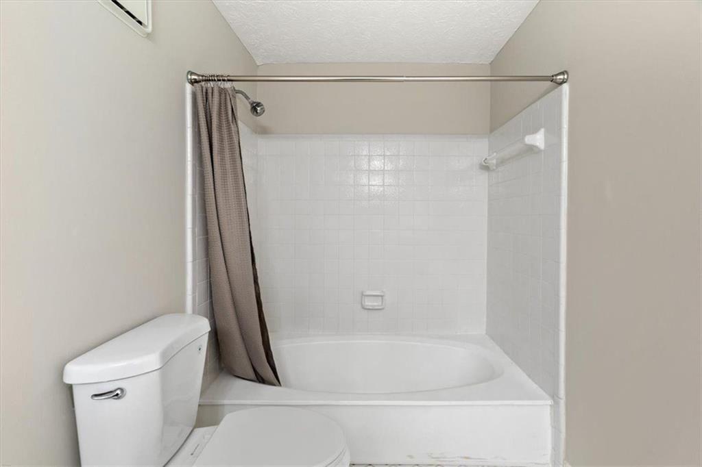1411 Oakridge Circle Decatur, GA 30033 - Photo 23 of 26 a bathroom with a shower and a toilet