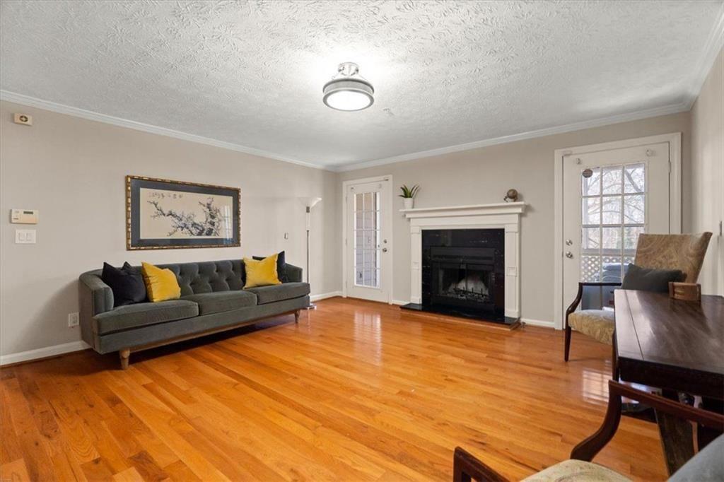1411 Oakridge Circle Decatur, GA 30033 - Photo 5 of 26 a living room with furniture and a fireplace