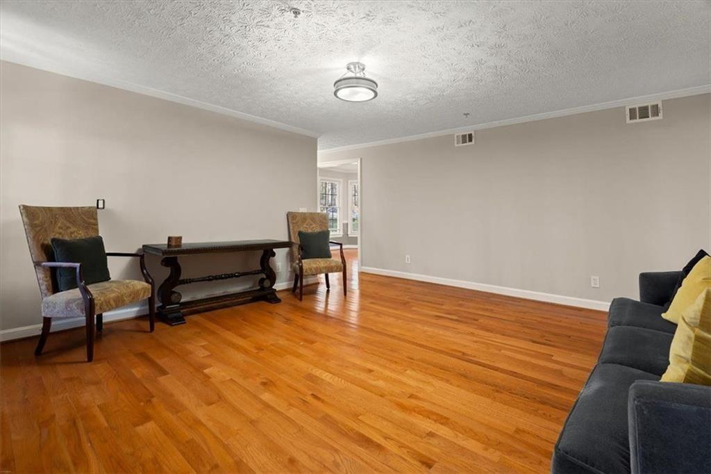 1411 Oakridge Circle Decatur, GA 30033 - Photo 7 of 26 a living room with furniture and a wooden floor