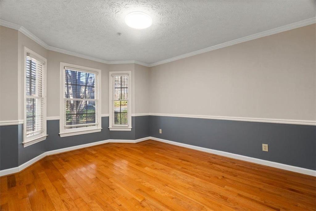 1411 Oakridge Circle Decatur, GA 30033 - Photo 8 of 26 a view of an empty room with a window
