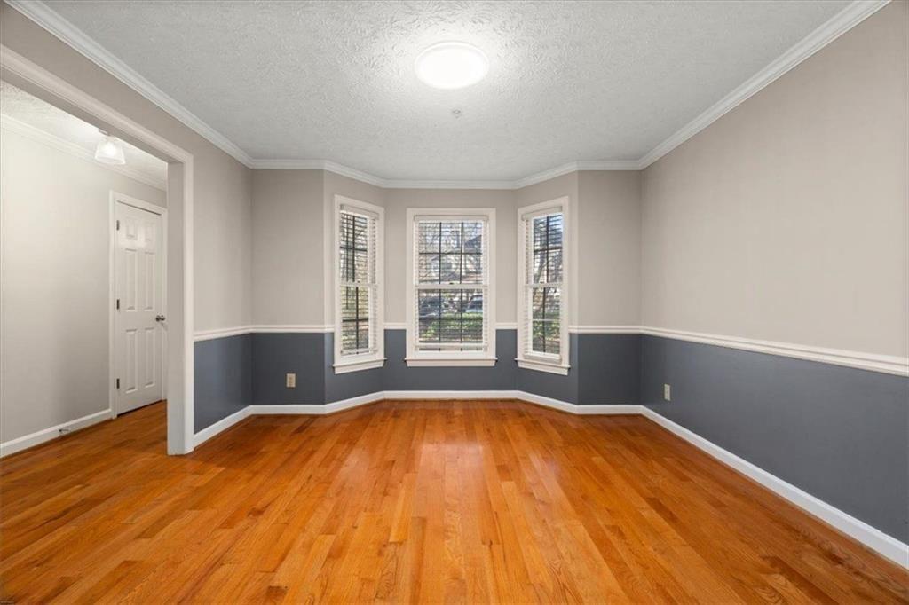 1411 Oakridge Circle Decatur, GA 30033 - Photo 9 of 26 a view of a room with wooden floor and windows