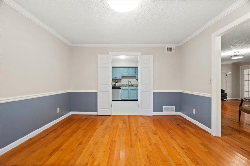1411 Oakridge Circle Decatur, GA 30033 - Photo 10 of 26 a view of empty room with wooden floor