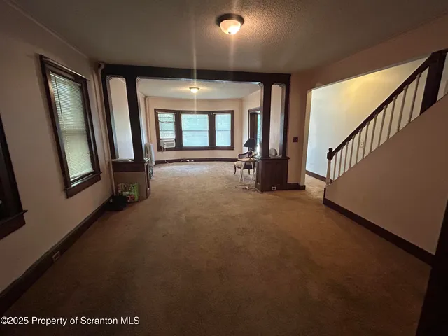 a view of a hallway with staircase