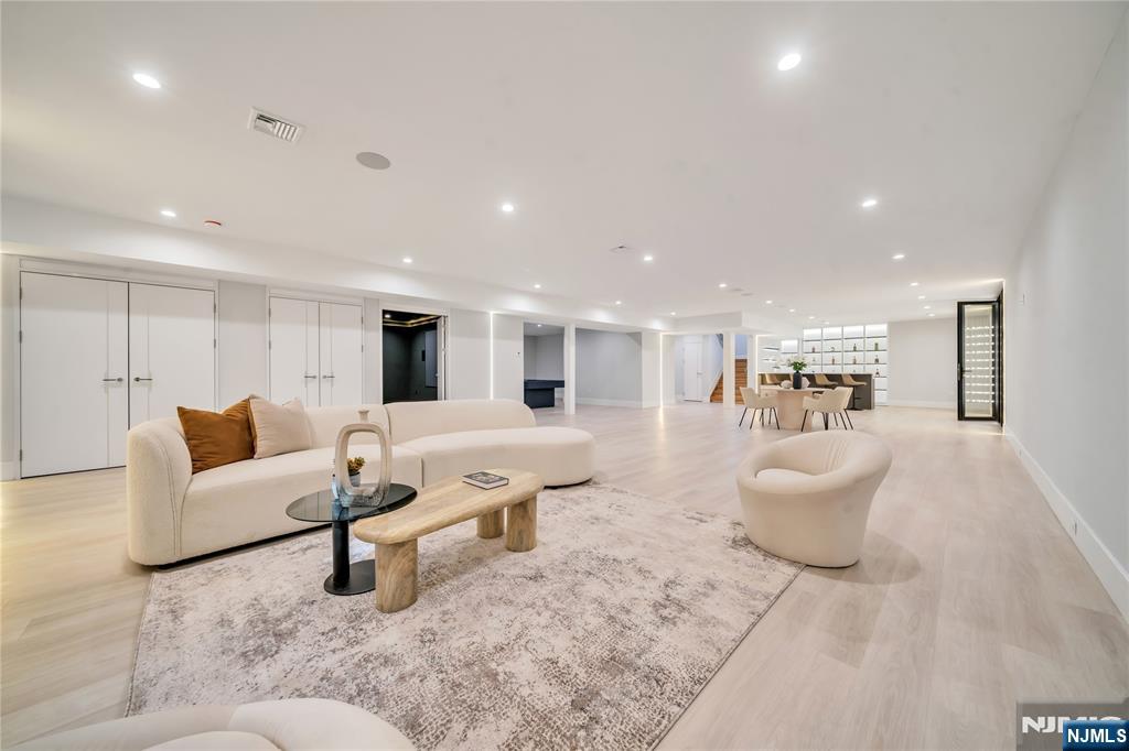 11 Roberts Road Englewood Cliffs, NJ 07632 - Photo 36 of 50 a living room with furniture and a couch