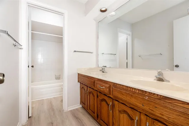 a view of a livingroom with a ceiling fan and window