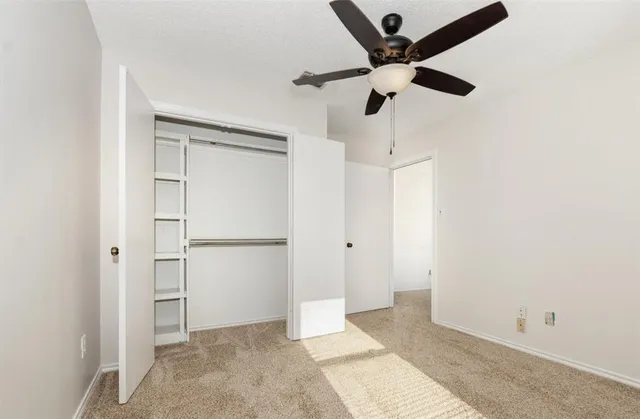 a view of a backyard with wooden fence