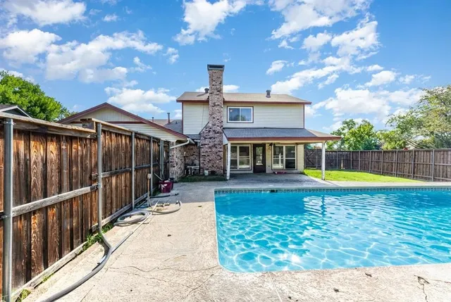 a view of a house with a swimming pool