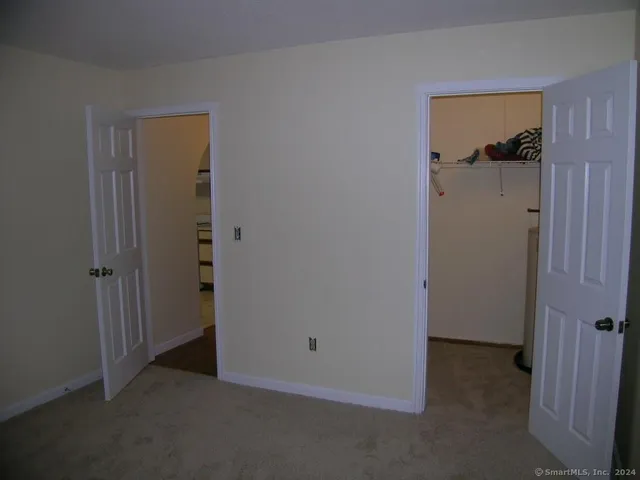 a view of a hallway with closet