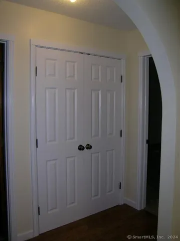 a view of a door with wooden floor