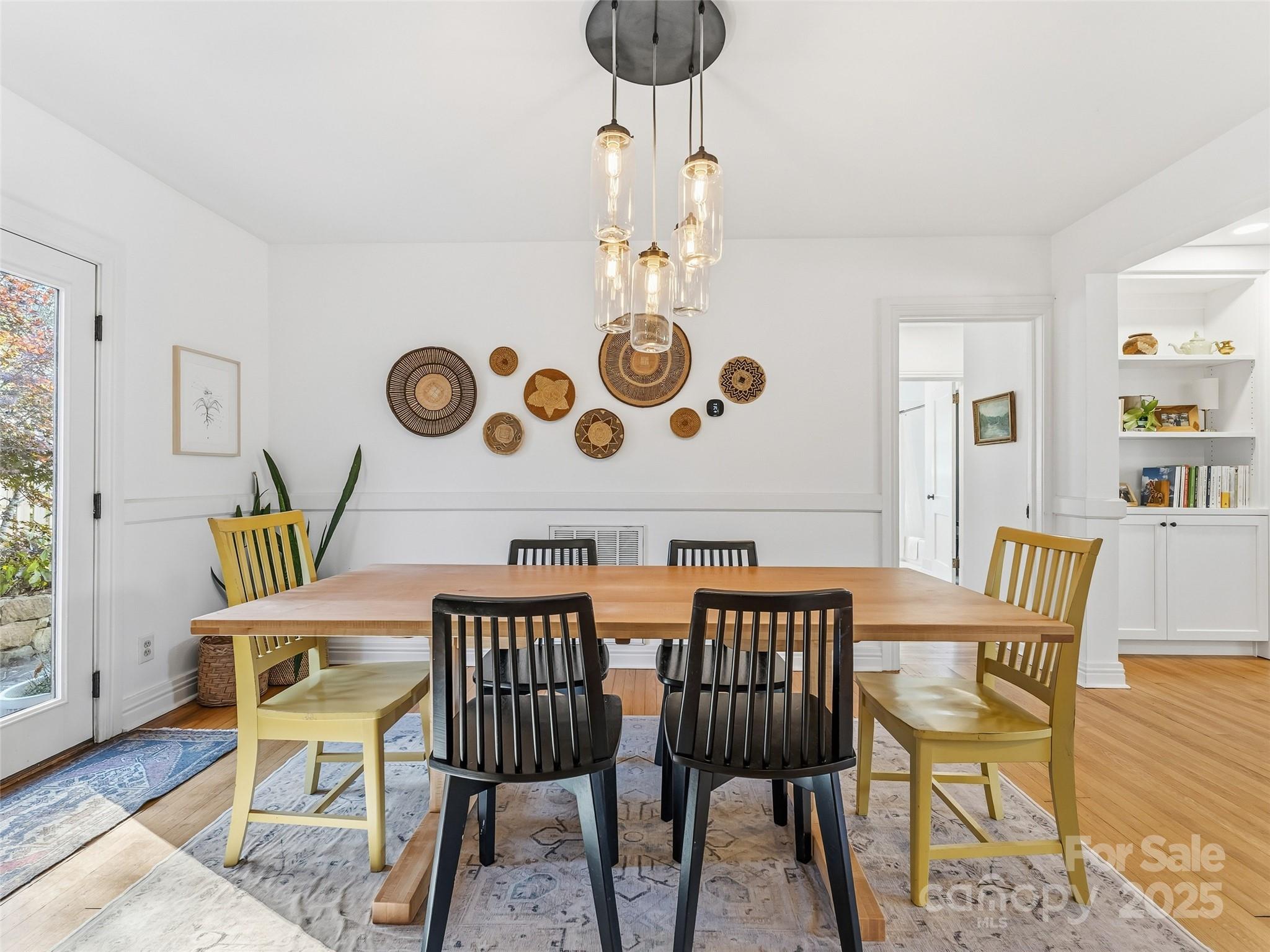140 Lakeview Avenue Brevard, NC 28712 - Photo 11 of 37 a view of a dining room with furniture and wooden floor