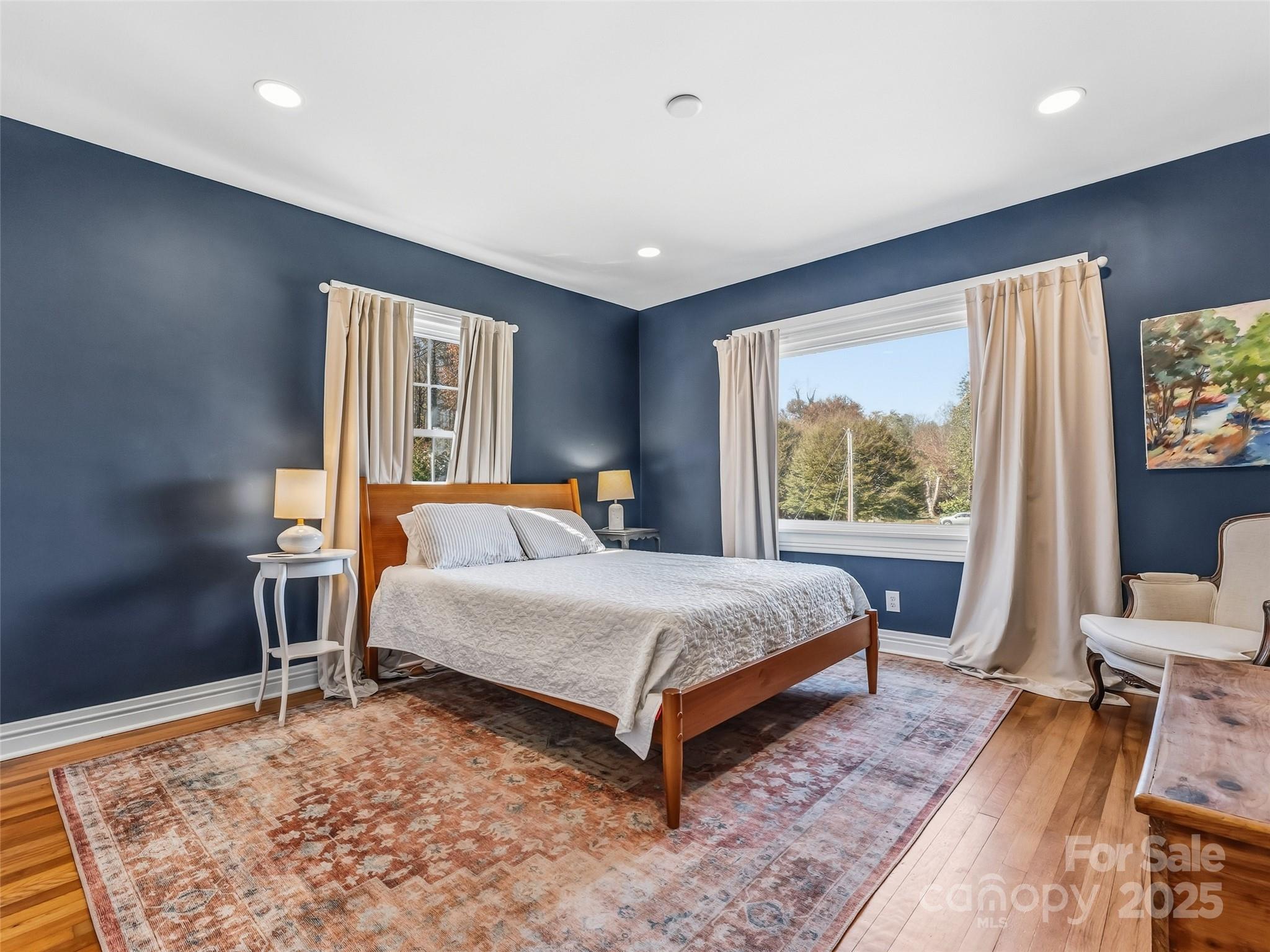 140 Lakeview Avenue Brevard, NC 28712 - Photo 20 of 37 a bed sitting in a bedroom next to a window