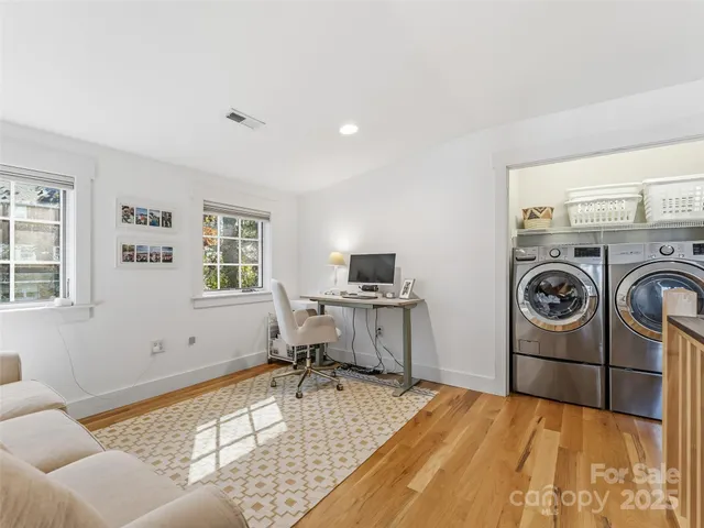 a bedroom with a bed and lamp